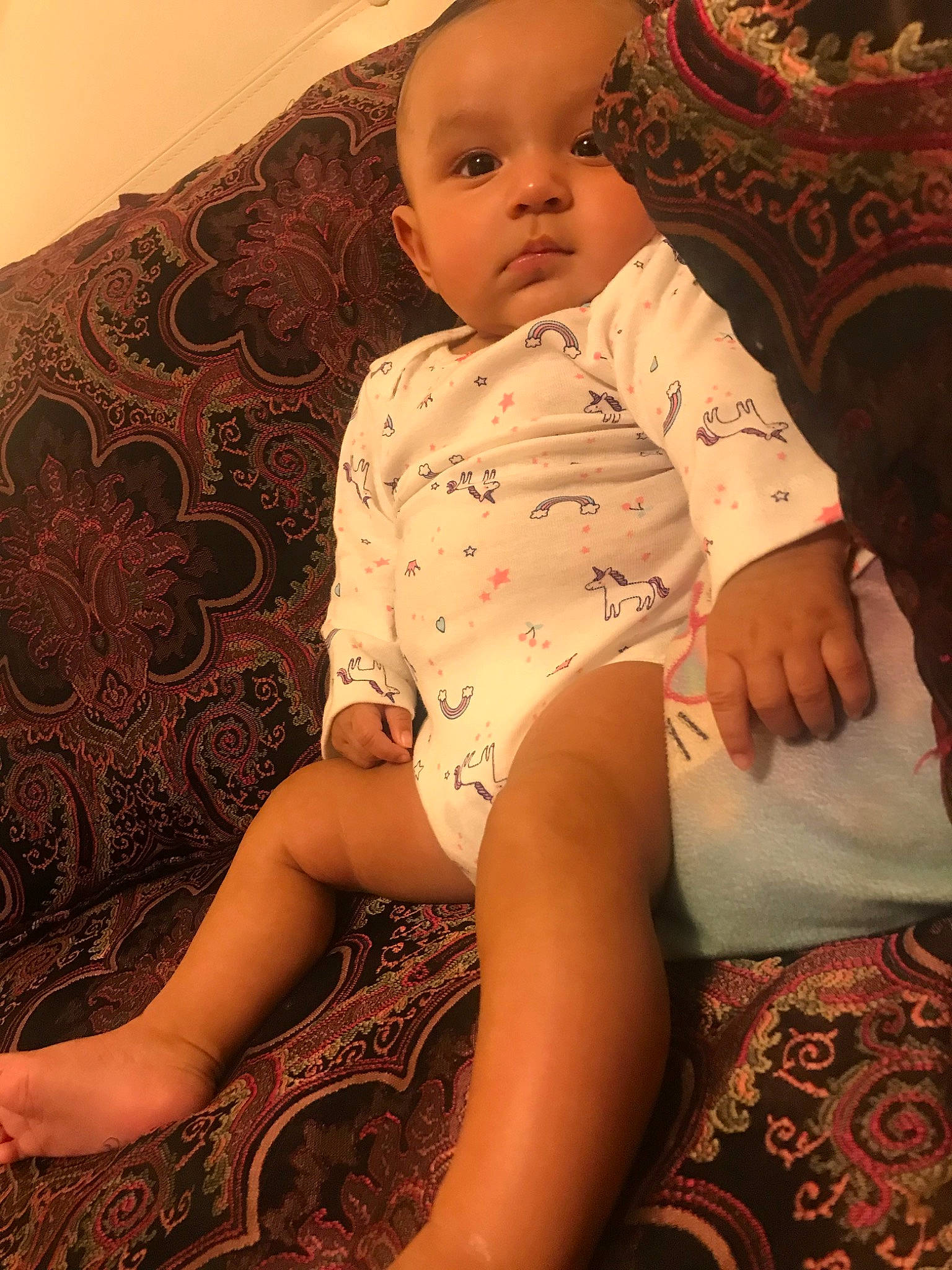 Chantel is registered to the contest to win money with this photo: arm, baby, barefoot, beauty, cheek, child, design, finger, foot, head, human_leg, leg, long_hair, pattern, person, sitting, skin, thigh, toddler