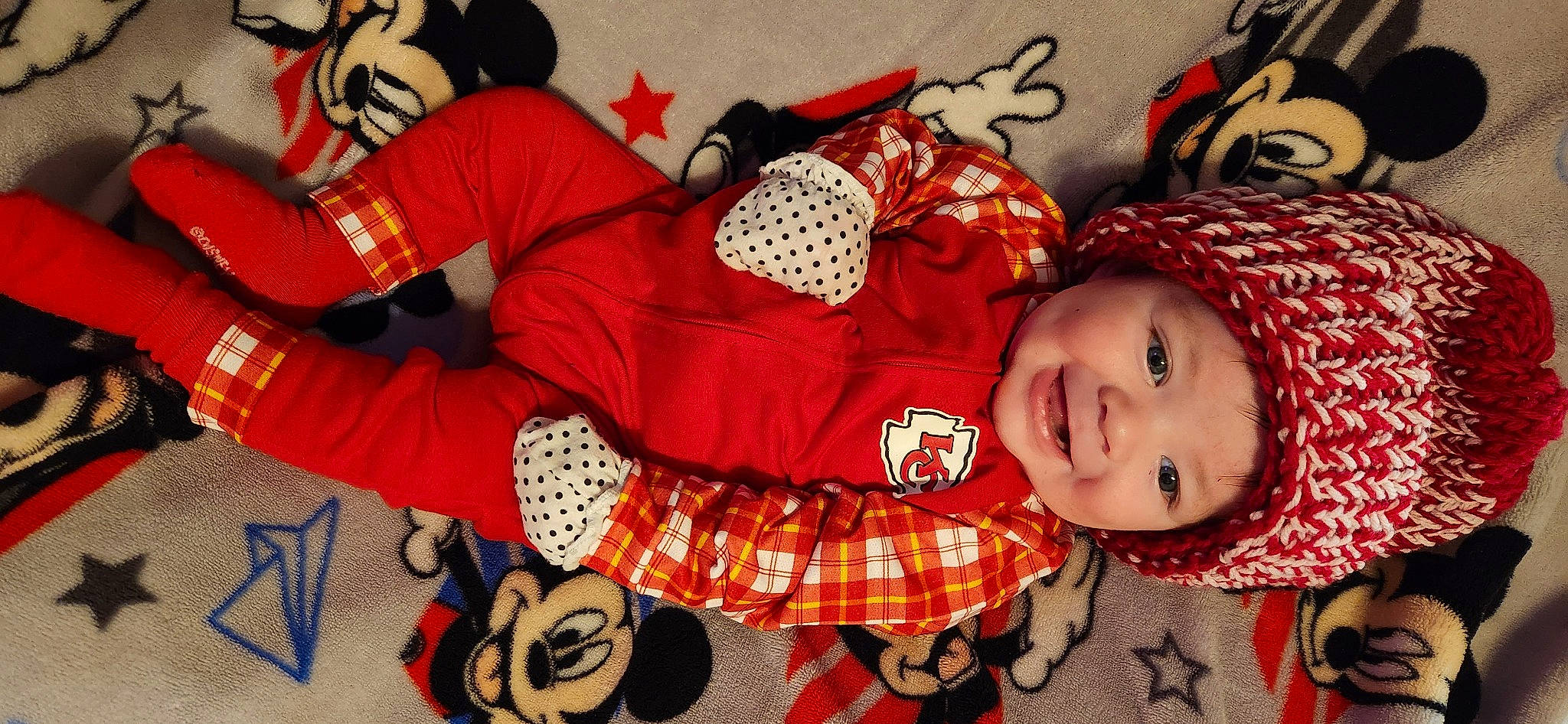 Ryder joined the competition — help win amazing prizes! baby_toddler_clothing, carmine, child, comfort, costume, costume_hat, event, fashion_accessory, flooring, happy, headgear, headwear, holiday, joy, linens, pattern, person, red, room, sleeve