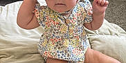 Addison joined the competition — help win amazing prizes! baby, child, sunglasses, floral_clothing, bonnet, romper, cushion, nursery, crib, carpet, sock, seated, indoor, cute, fashion, infant, person, playful, accessory, portrait