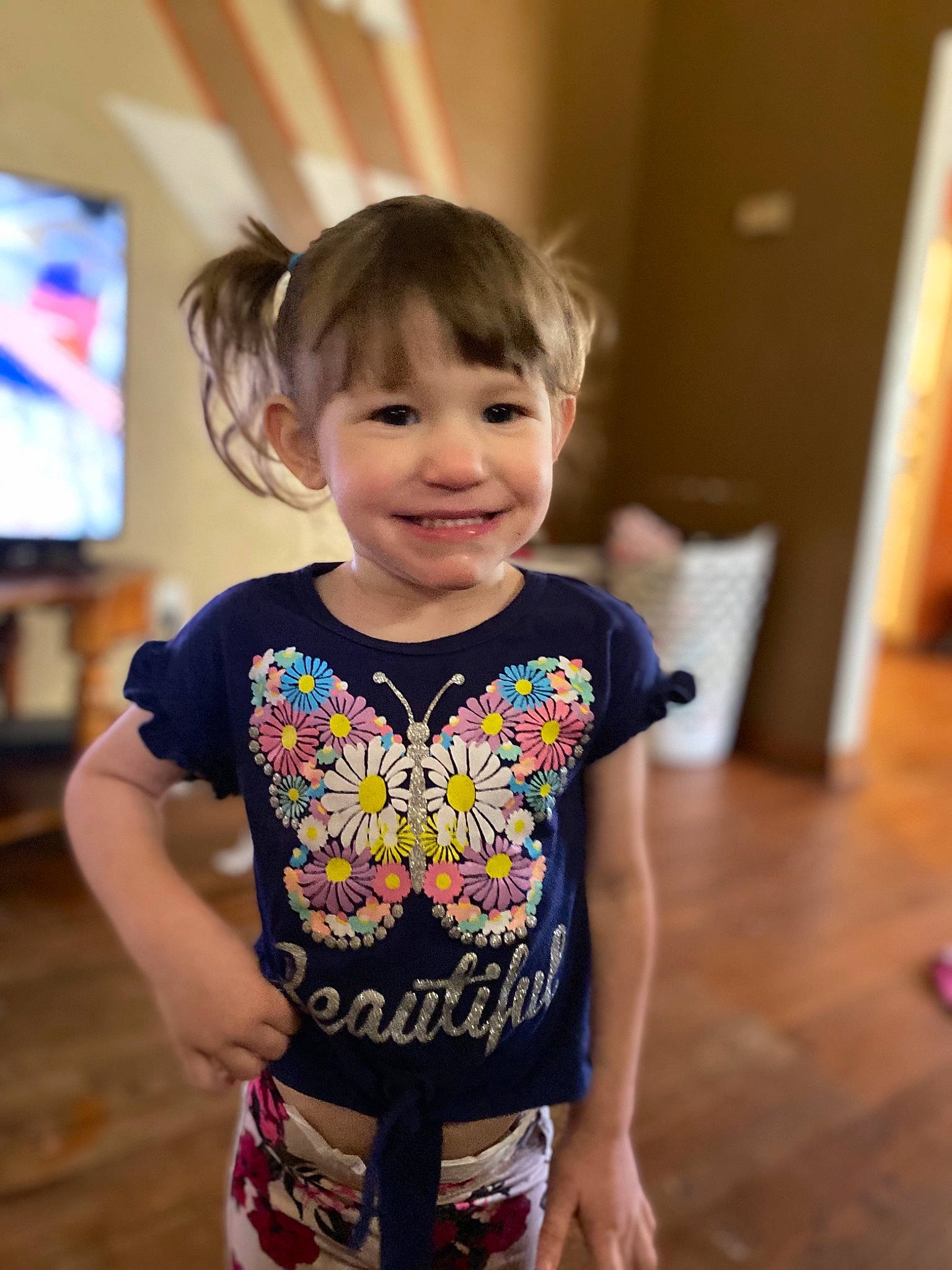 Ella joined the competition — help win amazing prizes! baby_toddler_clothing, child, event, face, facial_expression, flooring, fun, happy, hardwood, iris, joy, pattern, person, play, sleeve, smile, t_shirt, television, toddler, trunk