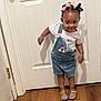 toddler, child, indoor, door, denim_overalls, rainbow_patch, hair_bows, pink_bow, blue_bow, sparkly_shoes, wooden_floor, white_door, smiling, standing, playful, cute, person, clothing, happy, young_child