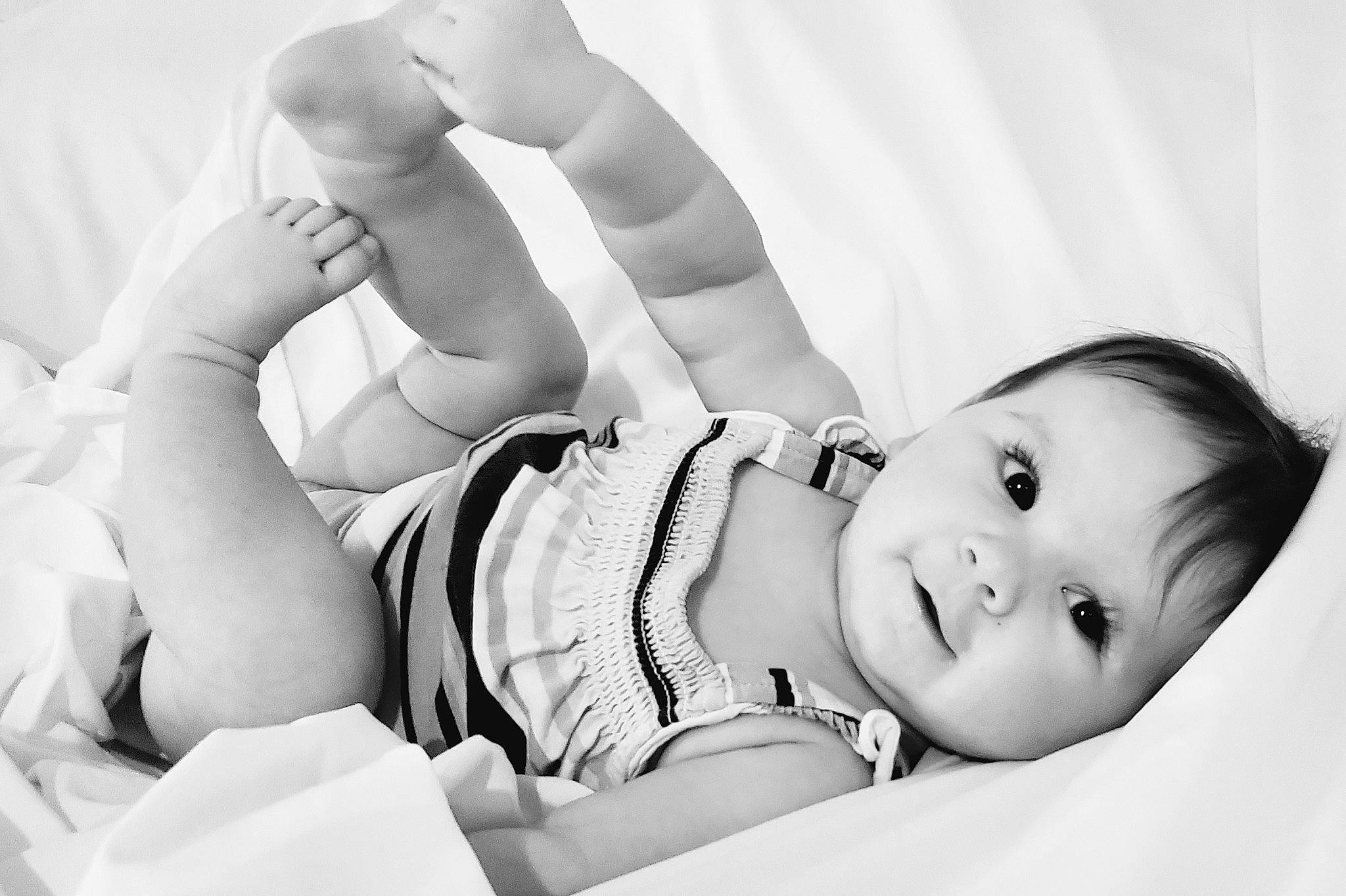 Olivia joined the competition — help win amazing prizes! baby, black_and_white, comfort, elbow, eye, eyelash, finger, flash_photography, gesture, hand, happy, head, iris, knee, monochrome_photography, person, skin, style, thigh, toddler