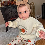 Pearl joined the competition — help win amazing prizes! baby, child, blue_eyes, headband, bow, sweater, pumpkin, leggings, autumn, decor, fireplace, rug, floor, indoor, person, cute, infant, seasonal, home, cozy