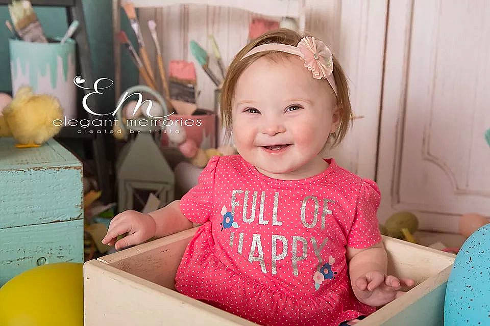 Emilee is registered to the contest to win money with this photo: baby, baby_toddler_clothing, birthday, cheek, child, daughter, ear, face, happy, head, joy, party, person, pink, room, skin, smile, toddler