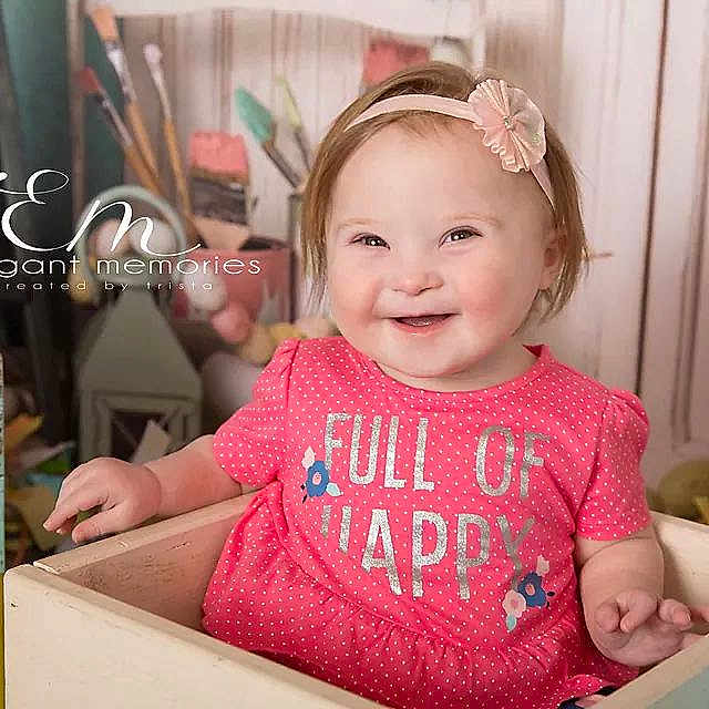 Emilee is registered to the contest to win money with this photo: baby, baby_toddler_clothing, birthday, cheek, child, daughter, ear, face, happy, head, joy, party, person, pink, room, skin, smile, toddler