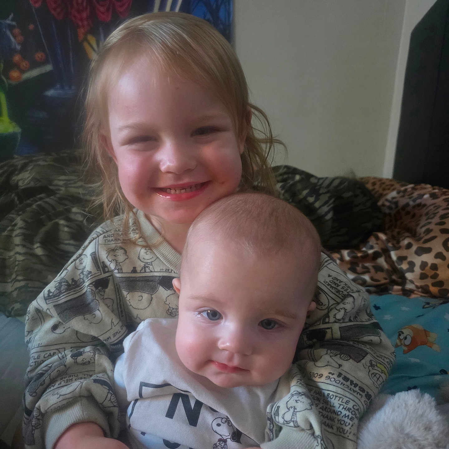 Oktober is registered to the contest to win money with this photo: baby, bed, blanket, child, clothing, cozy, cute, face, family, happy, head, hug, indoor, person, plush, sitting, sleepwear, smile, toddler, young_child