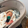 Lux is registered to the contest to win money with this photo: baby, baby_clothes, baby_supplies, bassinet, blanket, child, cozy, cushion, furniture, indoor, infant, newborn, nursery, pacifier, peaceful, resting, sleeping, soft_lighting, wrapped, young_child