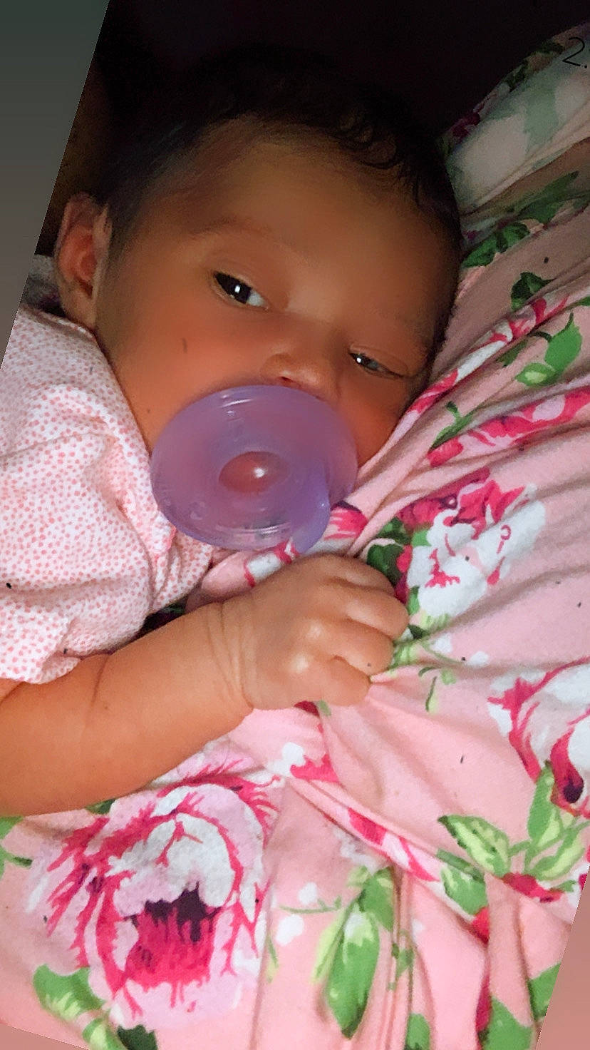 Nova-dream is registered to the contest to win money with this photo: baby, baby_bottle, baby_grabbing_for_something, baby_products, baby_toddler_clothing, bottle, cheek, child, floral_design, linens, nail, peach, person, pink, plastic_bottle, skin, toddler