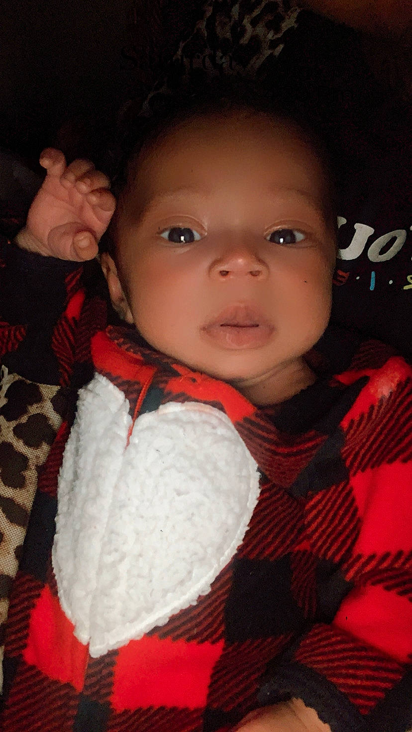 Nova-dream is registered to the contest to win money with this photo: baby, baby_toddler_clothing, black_hair, cheek, child, chin, cool, eyebrow, forehead, iris, lip, organ, pattern, person, plaid, portrait_photography, skin, tartan, textile, thumb