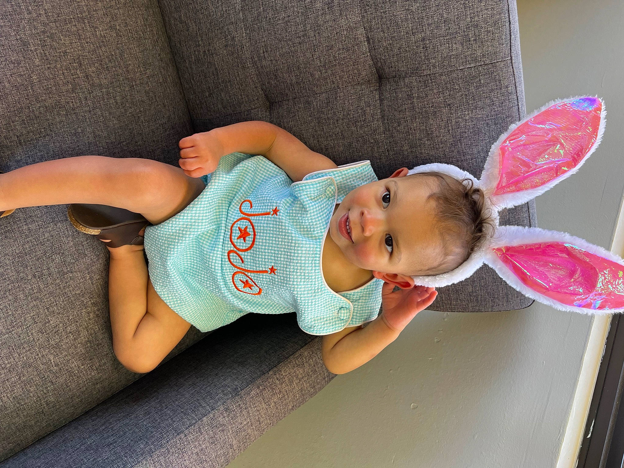 Jojo is registered to the contest to win money with this photo: arm, baby, baby_products, baby_sleeping, baby_toddler_clothing, child, comfort, finger, foot, happy, human_leg, leisure, person, pink, sitting, skin, sleeve, sock, textile, thigh