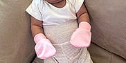 Jannatul Firdaus joined the competition — help win amazing prizes! baby, beige_background, child, comfort, couch, cozy, cute, indoor, infant, mittens, newborn, person, pink_hat, portrait, resting, sleepy, small, soft_fabric, striped_pants, white_onesie