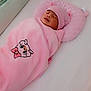 baby, bed, blanket, child, clothing, cozy, crib, cute, hat, indoors, infant, newborn, nursery, peaceful, pillow, pink, resting, sleeping, soft, wrapped