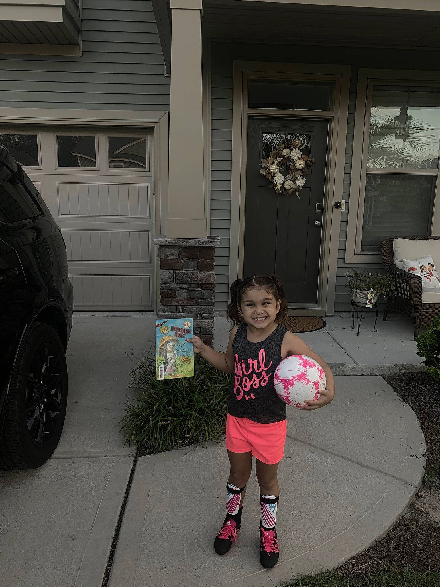 Kaileah is registered to the contest to win money with this photo: ball, car, child, door, family_car, footwear, home, house, joy, luxury_vehicle, person, pink, shoe, snapshot, standing, style, toddler, vehicle, world, yard