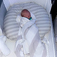 Knox joined the competition — help win amazing prizes! baby, newborn, blanket, bassinet, pacifier, sleeping, infant, cozy, white, gray, pillow, wrapped, resting, soft, cushioned, peaceful, indoors, bed, child, portrait