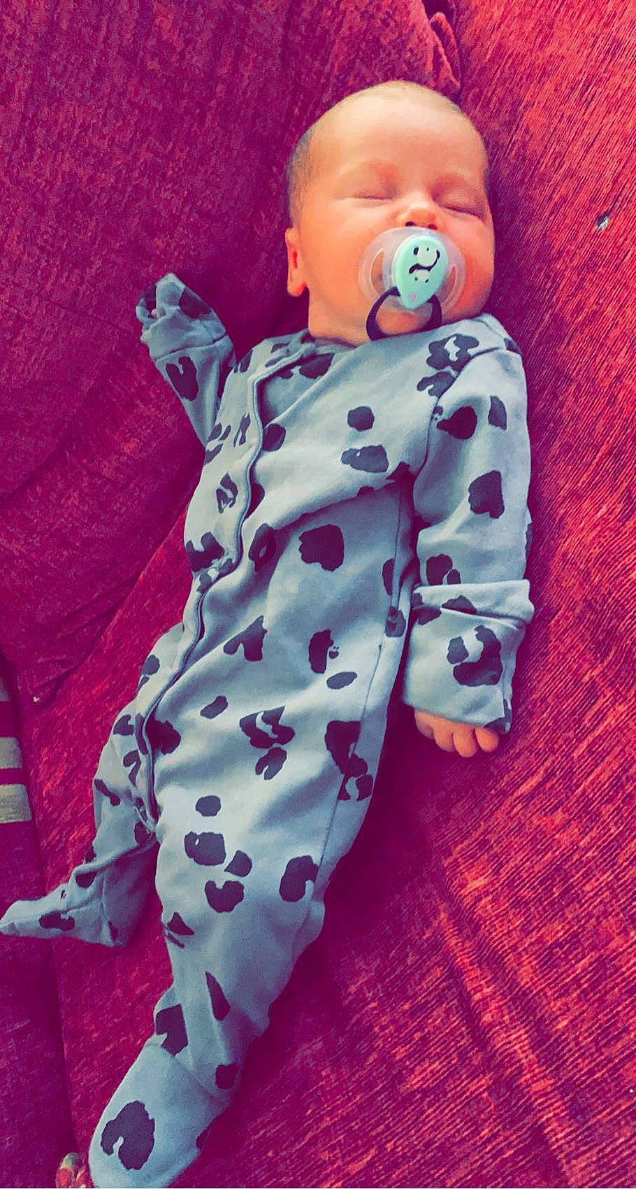 Devlin joined the competition — help win amazing prizes! arm, baby, baby_sleeping, baby_toddler_clothing, child, collar, comfort, dress, face, happy, human_body, linens, magenta, outerwear, pattern, person, pink, purple, sleeve, t_shirt