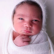 Corey is registered to the contest to win money with this photo: newborn, baby, infant, child, portrait, face, bonnet, hat, blanket, swaddled, white, cozy, sleepy, eyes, hands, fingers, closeup, indoor, soft_lighting, photography