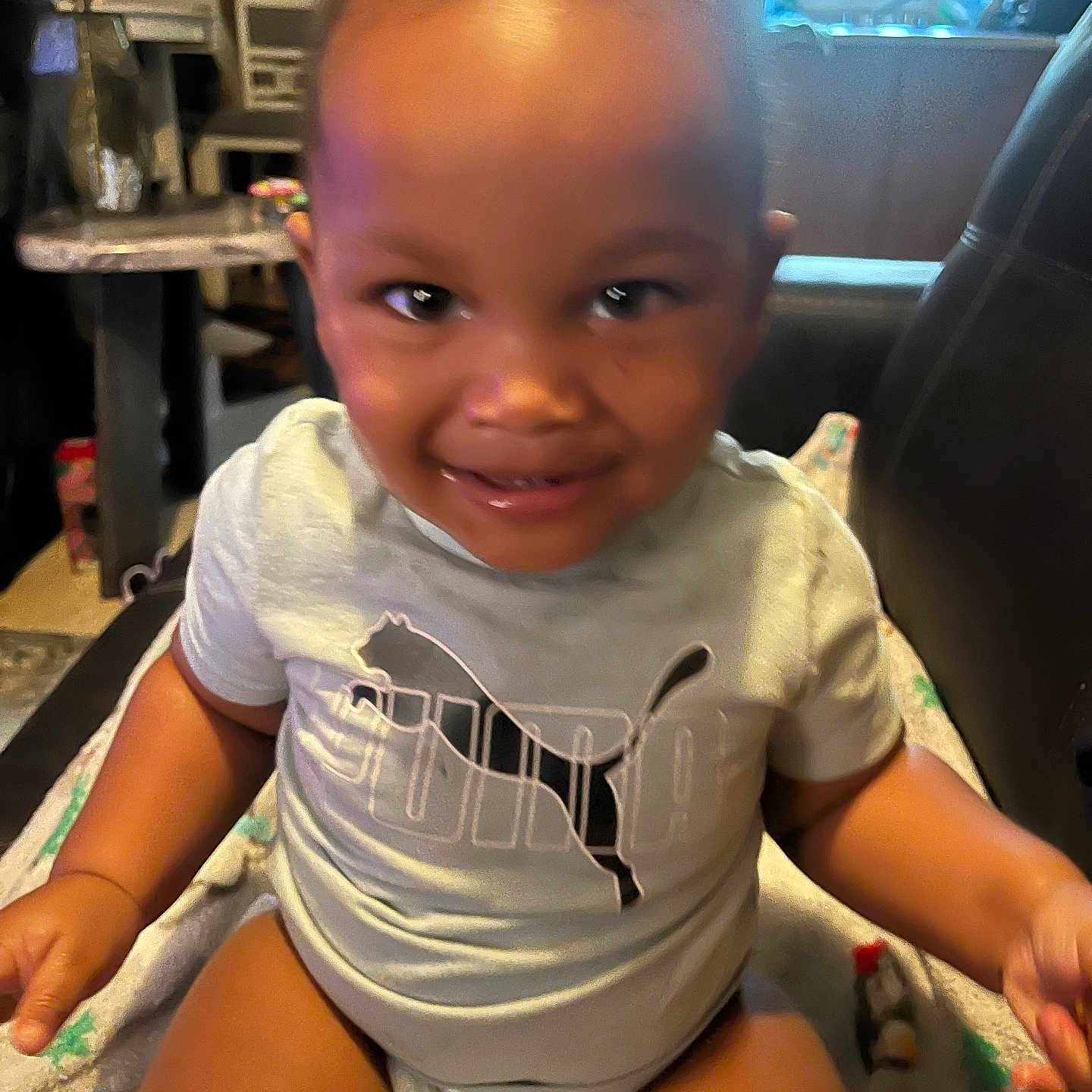 Camron Scott Jr joined the competition — help win amazing prizes! baby, blanket, casual_clothing, child, cute, diaper, face, happy, home, indoor, infant, person, playful, portrait, puma_shirt, sitting, smiling, toddler, young, young_child