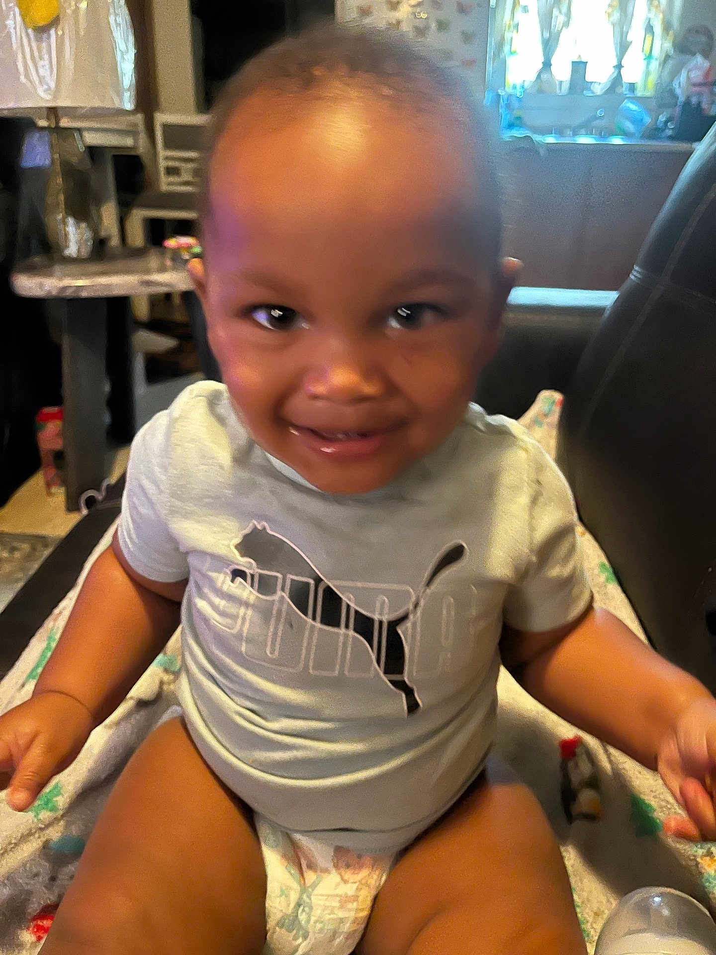 Camron Scott Jr joined the competition — help win amazing prizes! toddler, child, smiling, indoor, puma_shirt, diaper, blanket, happy, baby, person, cute, face, sitting, young_child, playful, casual_clothing, home, infant, portrait, young