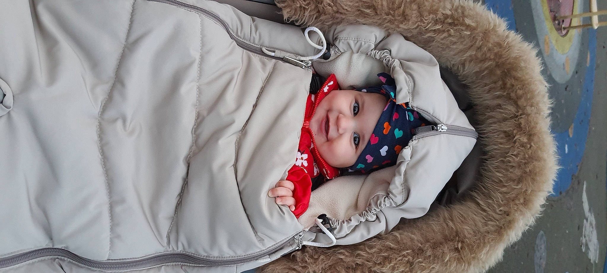Kaya joined the competition — help win amazing prizes! animal_product, baby, baby_products, baby_toddler_clothing, child, comfort, costume_accessory, fur, fur_clothing, headwear, hood, human, joy, natural_material, nose, parka, person, textile, toddler, winter