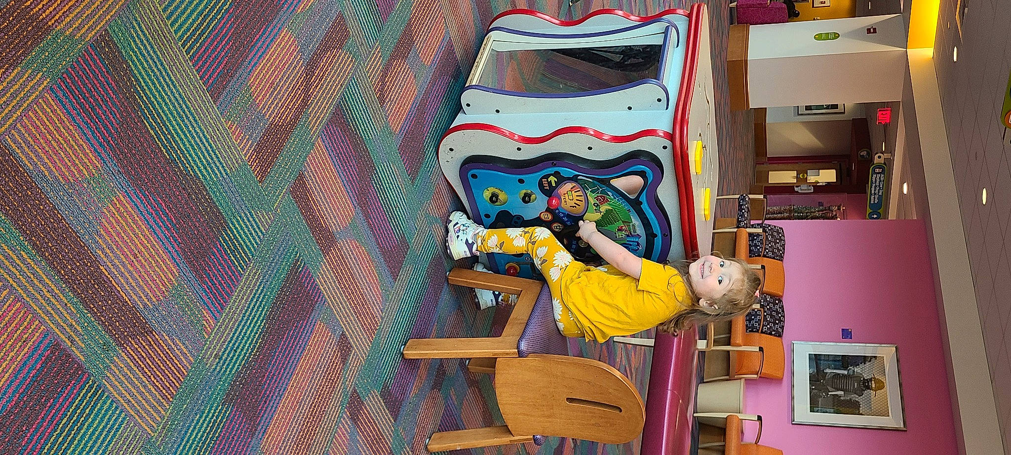 Gabriella is registered to the contest to win money with this photo: art, artist, chair, child, fun, illustration, joy, leisure, machine, magenta, mural, painting, pattern, person, pink, recreation, room, shelf, shelving, textile