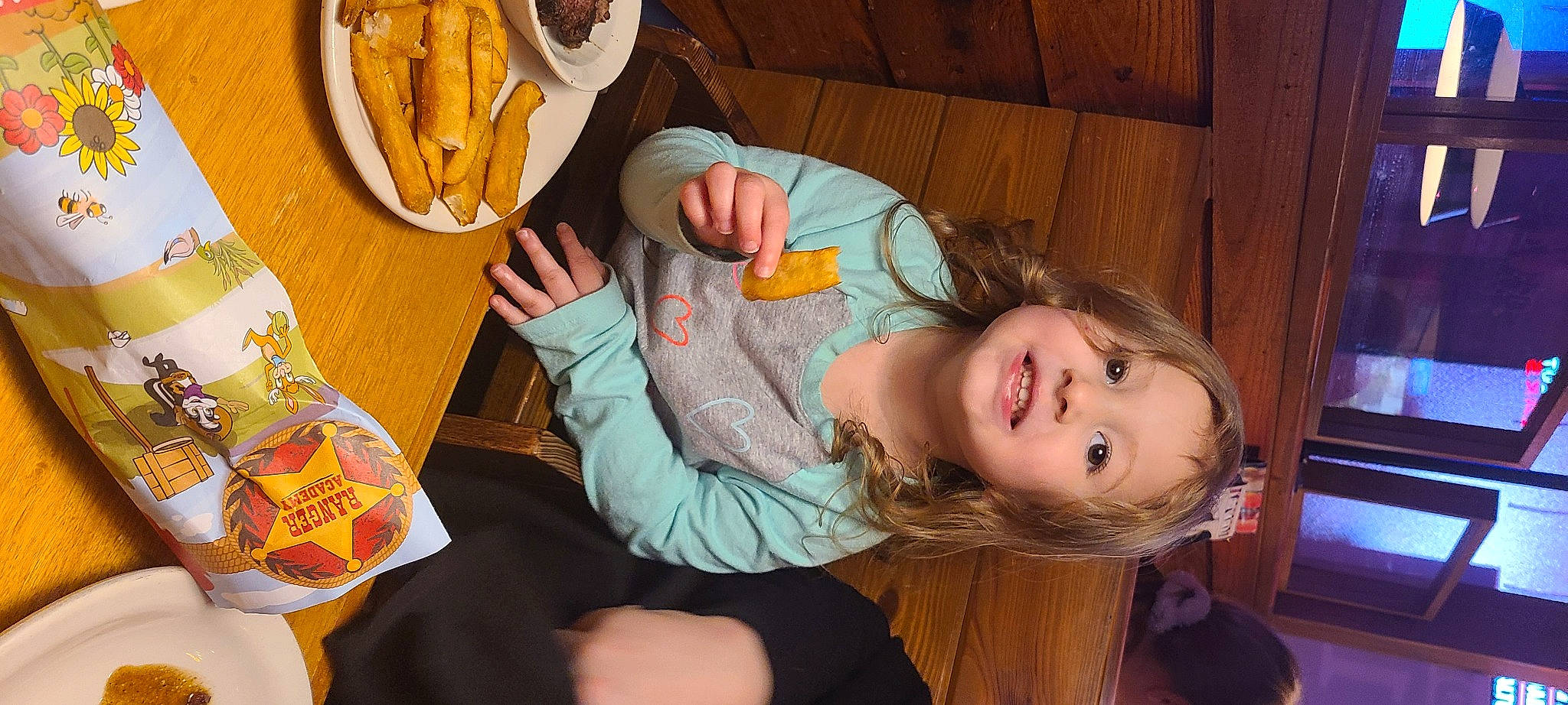 Gabriella is registered to the contest to win money with this photo: banana_family, child, comfort_food, fast_food, finger_food, food, fried_food, fun, happy, ingredient, joy, junk_food, leisure, person, plate, platter, saba_banana, sitting, smile, tableware