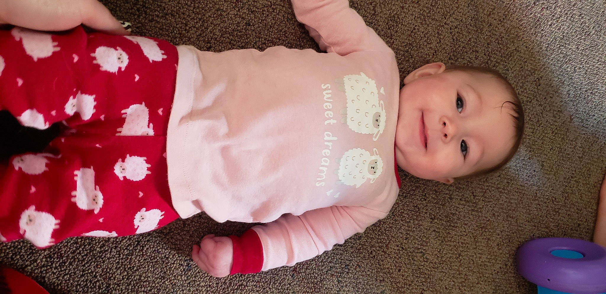 Gabriella is registered to the contest to win money with this photo: baby, baby_toddler_clothing, dress, eye, finger, gesture, hand, headgear, human_body, iris, joint, joy, leg, nail, person, pink, product, skin, sleeve, textile