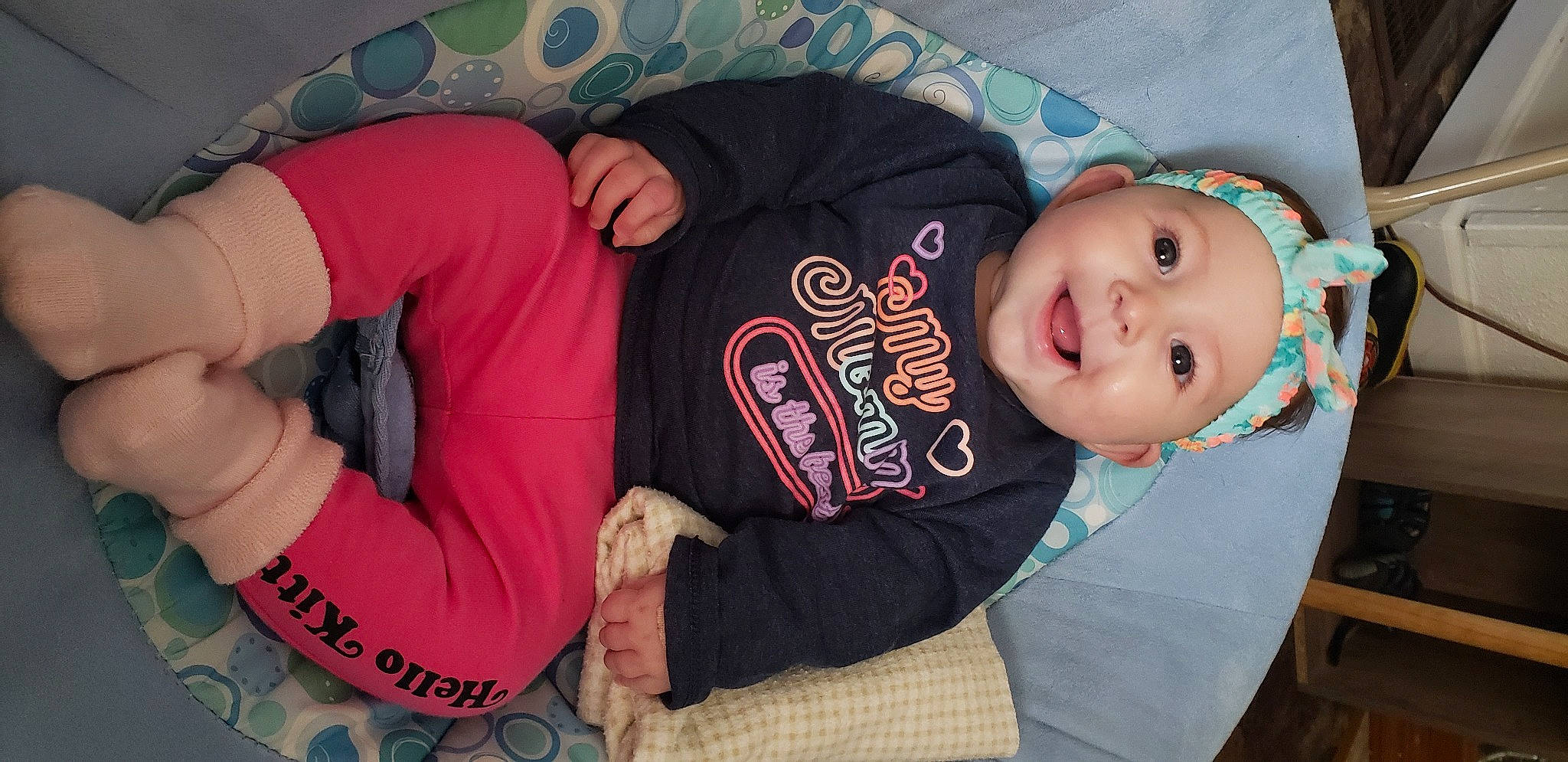 Gabriella joined the competition — help win amazing prizes! arm, baby, baby_toddler_clothing, cheek, comfort, cool, elbow, finger, gesture, hand, headwear, human_body, mouth, person, pink, skin, sleeve, smile, t_shirt, thigh