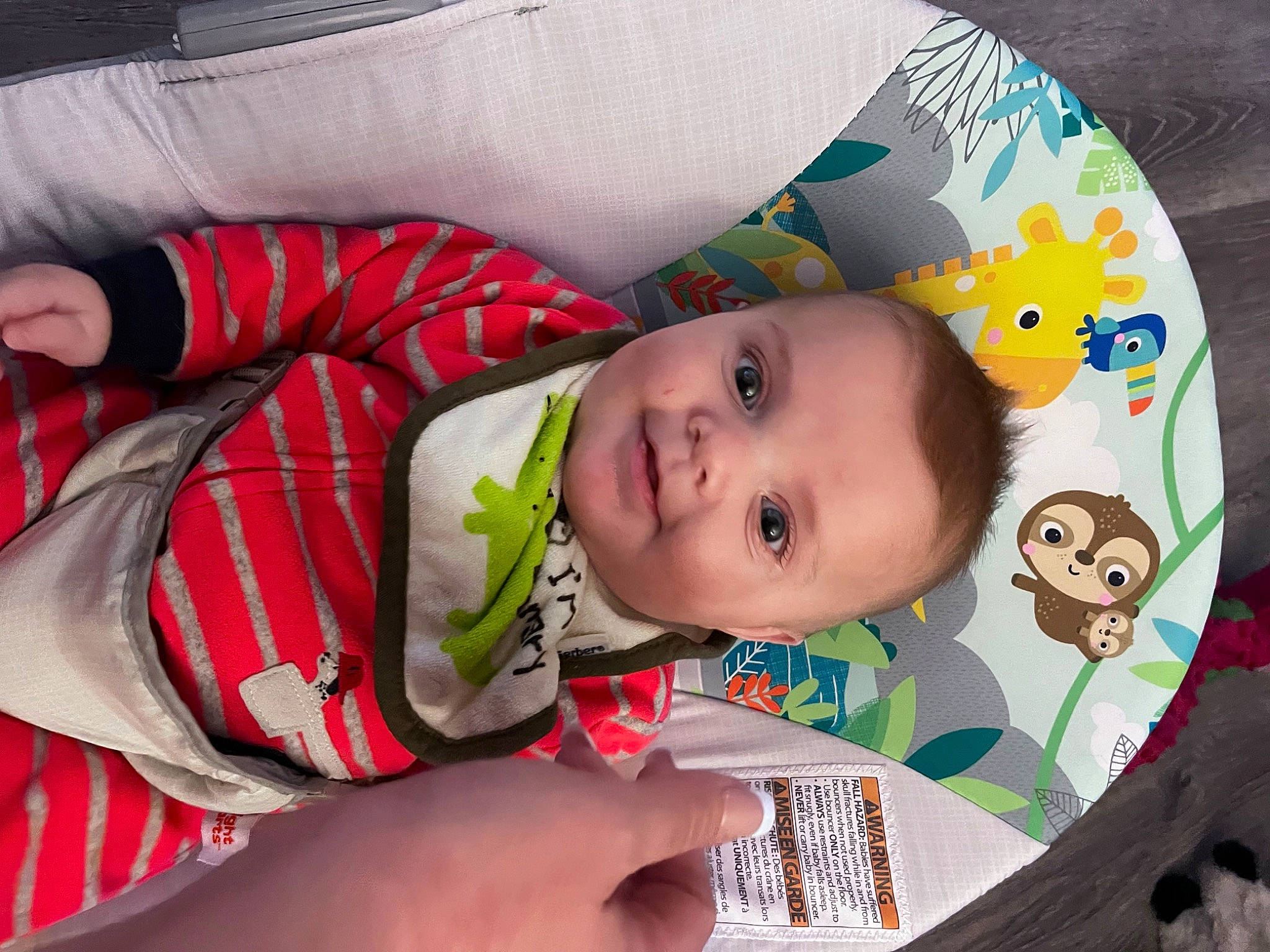 Brian is registered to the contest to win money with this photo: baby, baby_products, baby_toddler_clothing, cheek, child, comfort, eye, happy, human_body, iris, lip, nose, pattern, person, sitting, skin, sleeve, smile, textile, toddler