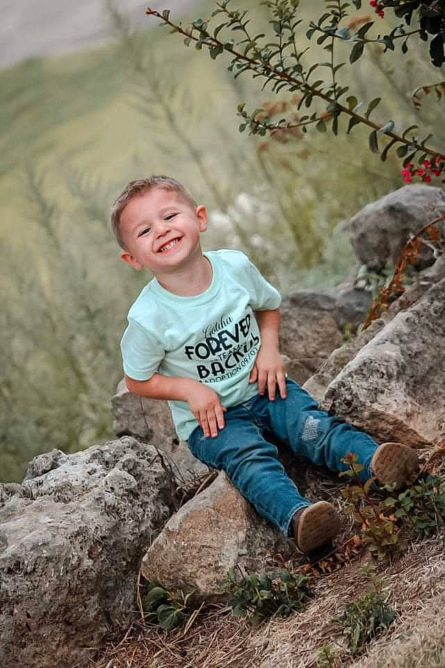 Noah is registered to the contest to win money with this photo: beauty, bedrock, eye, face, flash_photography, fun, grass, happy, human, joy, leaf, people, people_in_nature, person, plant, smile, summer, t_shirt, toddler, trunk