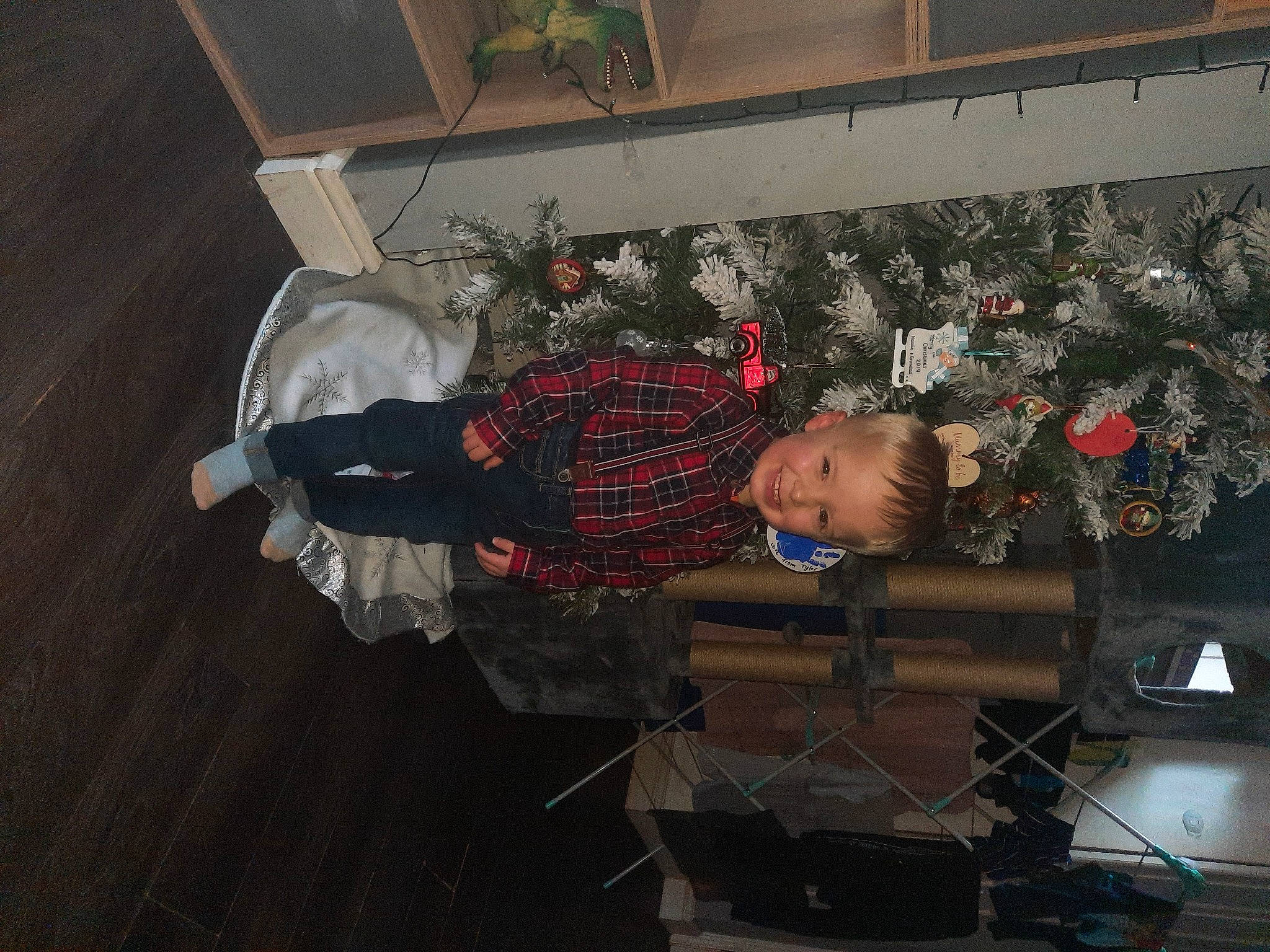 Tyler is registered to the contest to win money with this photo: carmine, event, flooring, fun, hardwood, holiday, joy, pattern, person, room, toddler, wood