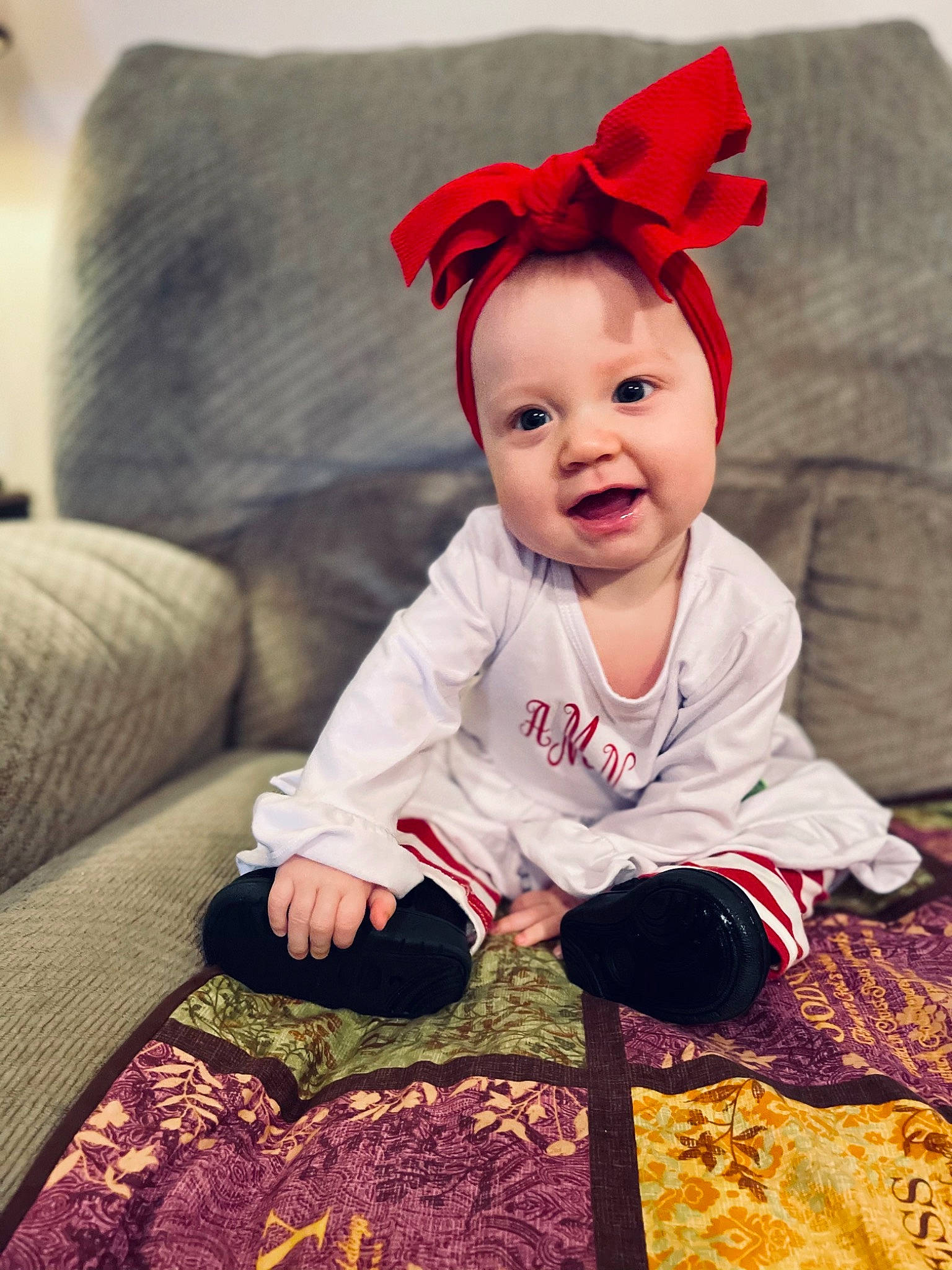 Ayla is registered to the contest to win money with this photo: baby, baby_toddler_clothing, child, costume, costume_accessory, costume_hat, couch, ear, eye, headband, human, human_body, living_room, mouth, nose, person, pillow, sofa_bed, studio_couch, throw_pillow