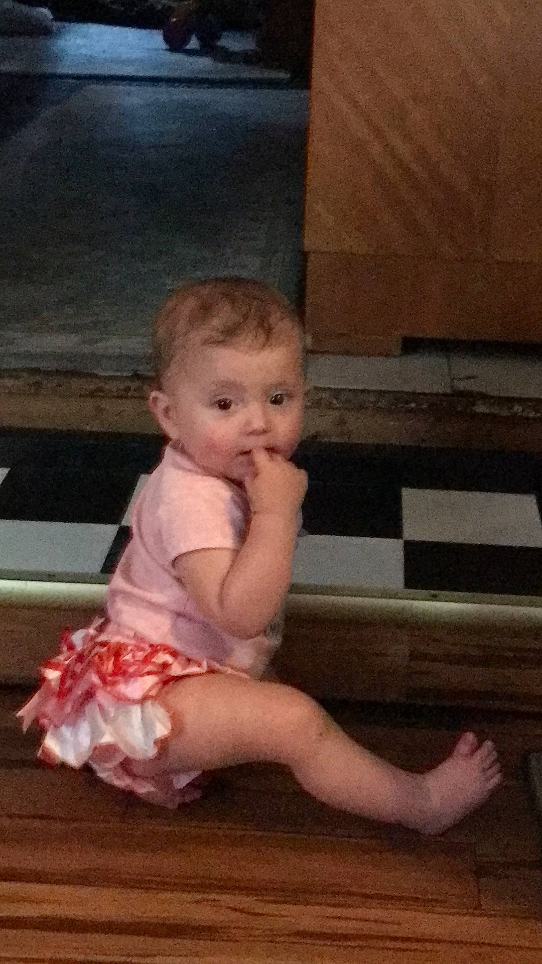 Piper is registered to the contest to win money with this photo: baby, baby_toddler_clothing, barefoot, child, day_dress, flooring, foot, fun, hair, happy, human_leg, leg, person, sandal, sitting, standing, tints_and_shades, toddler, wood