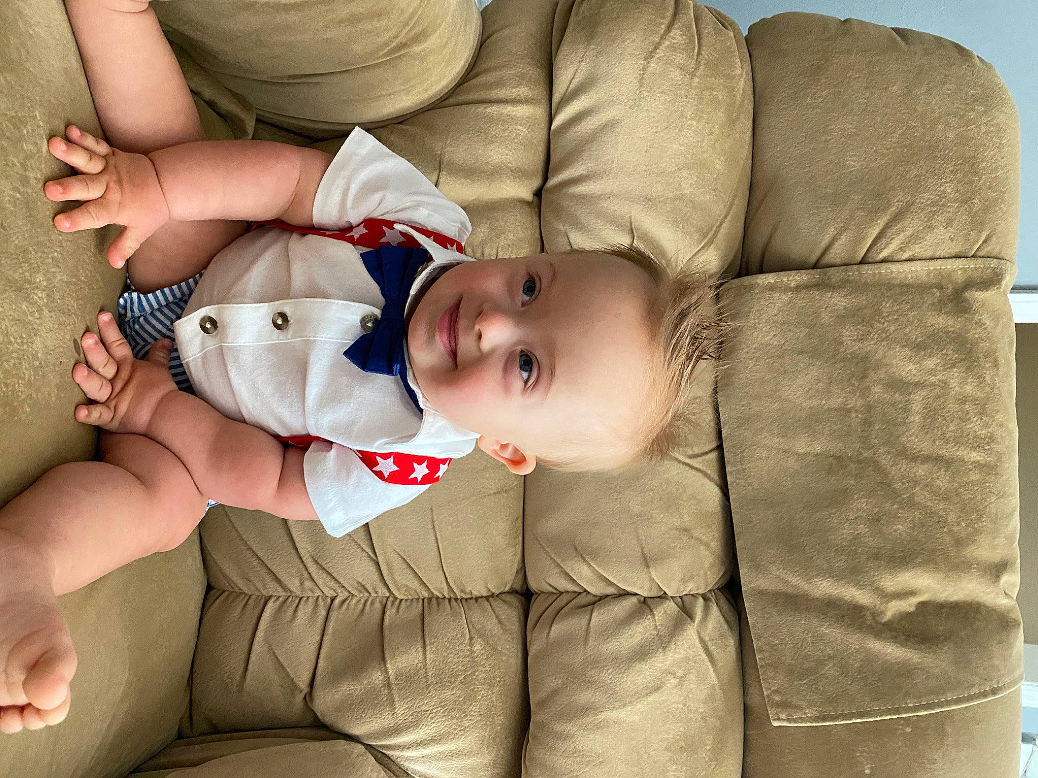 Lincoln joined the competition — help win amazing prizes! baby, baby_toddler_clothing, child, comfort, couch, elbow, facial_expression, flash_photography, hat, head, human_leg, joy, nail, pattern, person, sitting, skin, sun_hat, textile, thigh