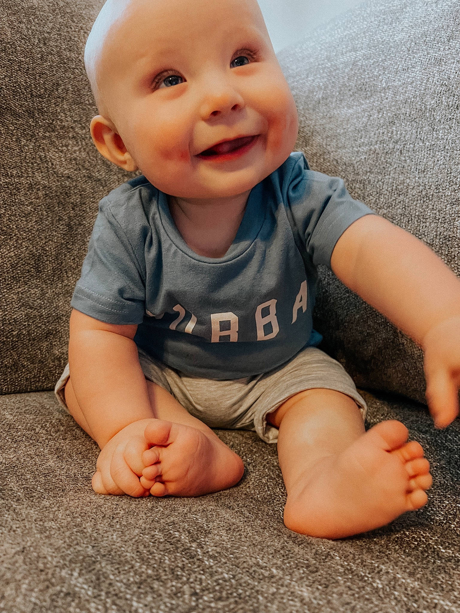Colten joined the competition — help win amazing prizes! baby, baby_toddler_clothing, cheek, child, eye, face, finger, floor, flooring, grass, happy, head, human_body, iris, joy, leg, nose, person, skin, sleeve