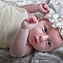 Rose participe au concours pour gagner de l'argent avec cette photo : baby, infant, face, headband, flower, pearl, blanket, soft_texture, skin, eyes, cute, newborn, lying_down, baby_clothes, portrait, closeup, child, adorable, peaceful, indoor