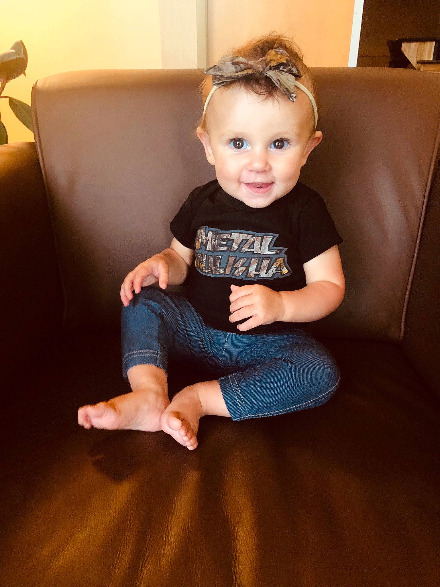 Bexlee is registered to the contest to win money with this photo: arm, baby, cheek, child, eye, face, finger, floor, flooring, hand, head, joint, leg, person, shoulder, sitting, skin, sleeve, standing, toddler