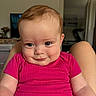 Ellie joined the competition — help win amazing prizes! baby, child, smile, face, blue_eyes, pink_shirt, indoors, person, portrait, skin, hair, legs, seated, cute, expression, infant, human, room, background, casual
