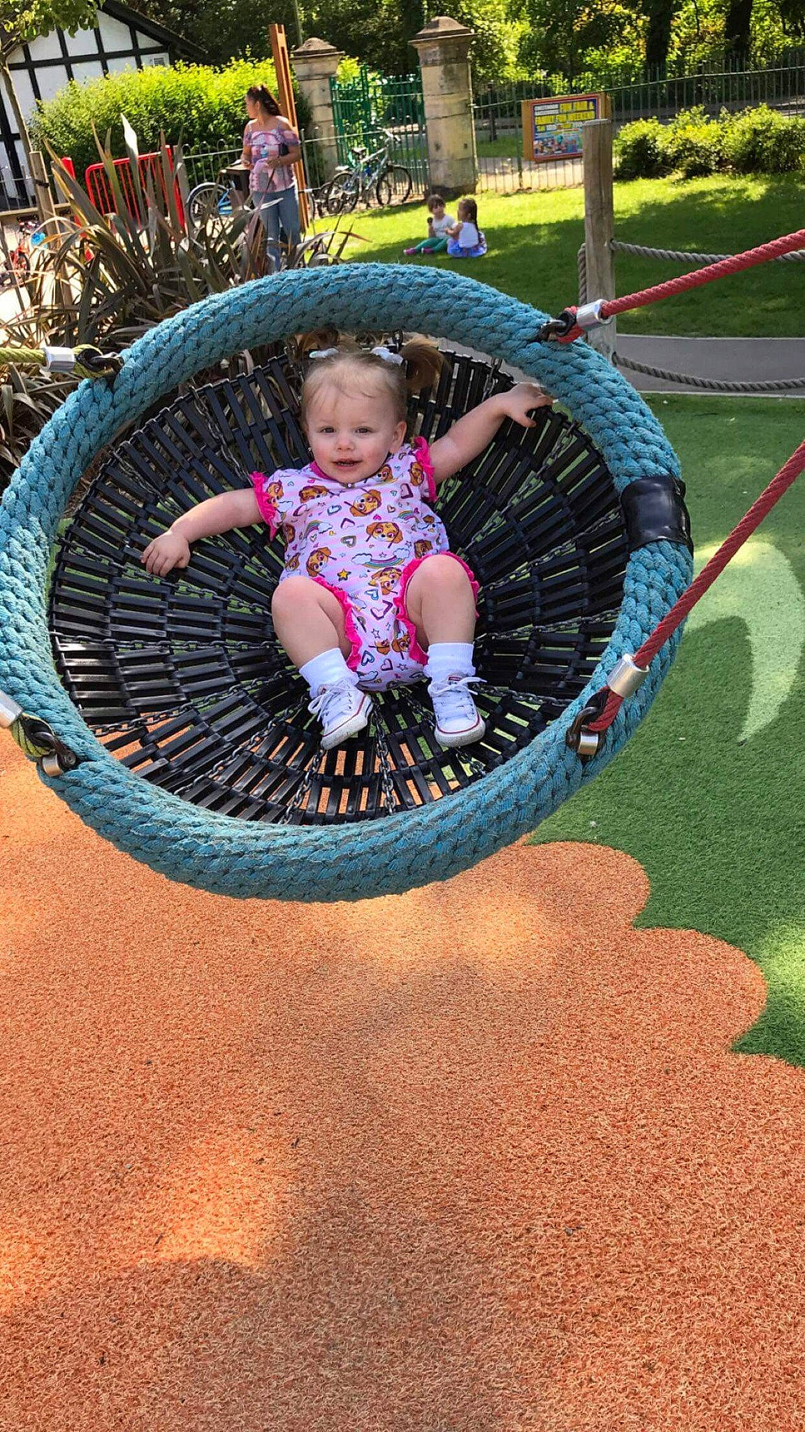 Blossom is registered to the contest to win money with this photo: backyard, child, city, fun, human_settlement, leisure, outdoor_play_equipment, person, plant, play, playground, public_space, recreation, toddler