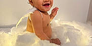 Islem a rejoint le concours — aidez-le/la à gagner de superbes lots ! angel_wings, baby, child, cloud_prop, cute, decor, fairy_lights, fluffy, hand, headband, infant, milestone_card, nine_months, portrait, sitting, skin, smiling, soft_lighting, studio, white_background