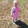 Eliza joined the competition — help win amazing prizes! baby, casual_clothing, child, cute, daylight, footwear, grass, happy, nature, outdoor, person, pink_clothing, playful, shadow, smiling, standing, sunlight, sunny, toddler, young_child