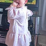 Eliza joined the competition — help win amazing prizes! toddler, child, pink_dress, indoor, standing, television, toy, floor, wooden_floor, furniture, cable, curtain, happy, young_child, person, cute, smiling, hand_in_mouth, home, playful