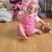 Eliza joined the competition — help win amazing prizes! baby, basket, blanket, child, childhood, cute, doll, floor, home, indoor, innocence, pacifier, person, pink_outfit, playtime, sitting, stuffed_animal, toddler, toy, wooden_floor