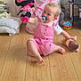 baby, basket, blanket, child, childhood, cute, doll, floor, home, indoor, innocence, pacifier, person, pink_outfit, playtime, sitting, stuffed_animal, toddler, toy, wooden_floor