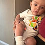 Jasper joined the competition — help win amazing prizes! baby, child, person, infant, onesie, clothing, hand, face, indoor, wall, floor, tile, sitting, cute, holding, halloween, costume, sock, skin, head
