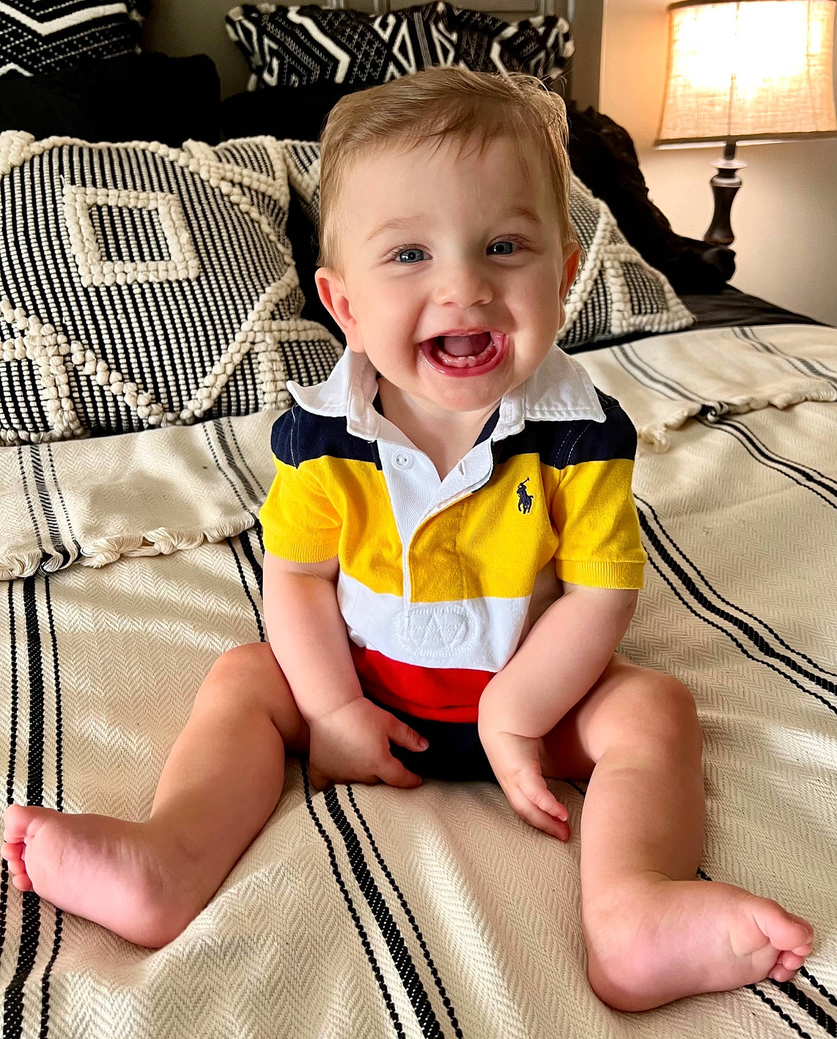 Caden is registered to the contest to win money with this photo: baby, baby_toddler_clothing, cheek, comfort, face, finger, happy, head, human_body, iris, joy, lamp, leg, person, shoe, skin, sleeve, smile, t_shirt, thigh