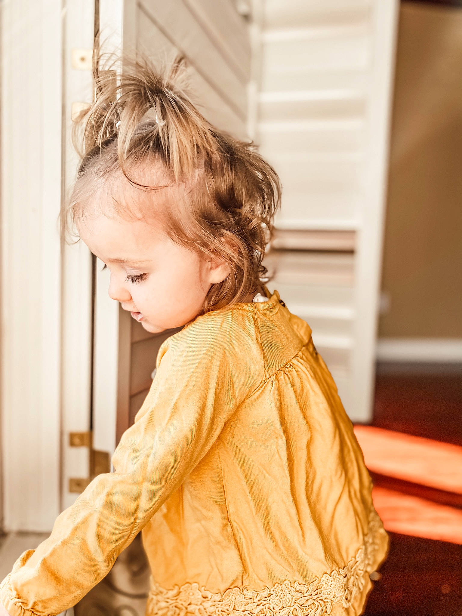 Adelaide joined the competition — help win amazing prizes! baby_toddler_clothing, blond, brown_hair, child, door, eye, face, floor, flooring, fun, hair, happy, hardwood, head, long_hair, person, sitting, sleeve, toddler, waist