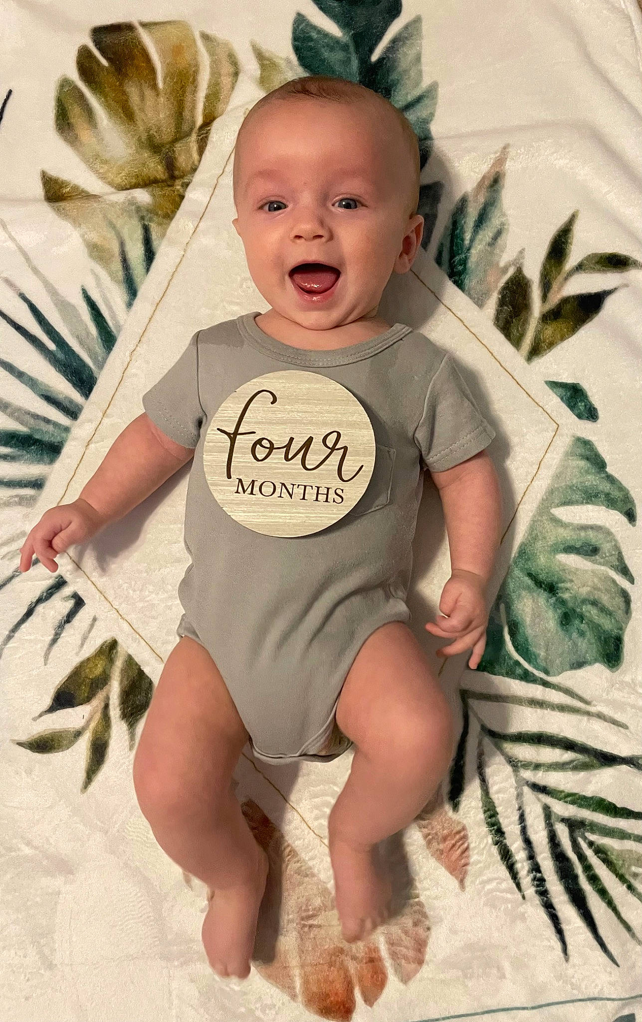 Baker is registered to the contest to win money with this photo: baby, baby_toddler_clothing, child, cool, eye, face, facial_expression, finger, hairstyle, happy, head, iris, person, pink, product, skin, sleeve, smile, t_shirt, textile