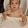 toddler, child, high_chair, cereal, food, bow, headband, pink_dress, infant, baby, feeding, table, messy, curious, face, portrait, indoor, person, skin, hands