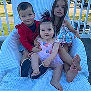 Giada Mae joined the competition — help win amazing prizes! child, children, baby, sitting, chair, outdoor, smiling, family, shoe, dress, red_hoodie, blue_sky, railing, deck, grass, car, happy, cute, portrait, playful