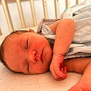 élya participe au concours pour gagner de l'argent avec cette photo : baby, bed, blanket, child, closeup, cozy, crib, cute, face, hand, indoors, infant, newborn, peaceful, person, rest, skin, sleeping, soft, toddler